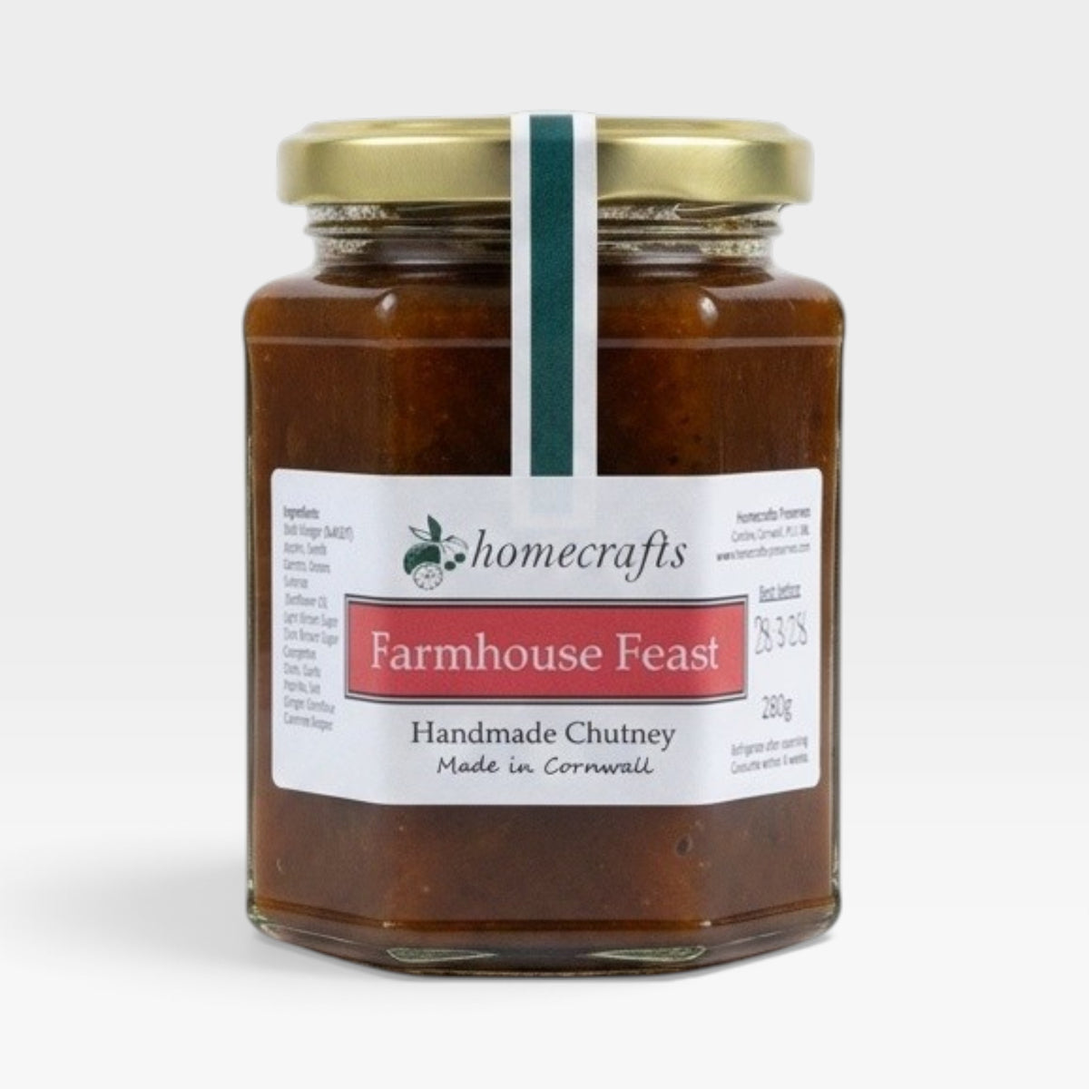 A glass jar of Homecrafts Farmhouse Feast Handmade Chutney with a gold lid and white label, set against a plain light gray background.