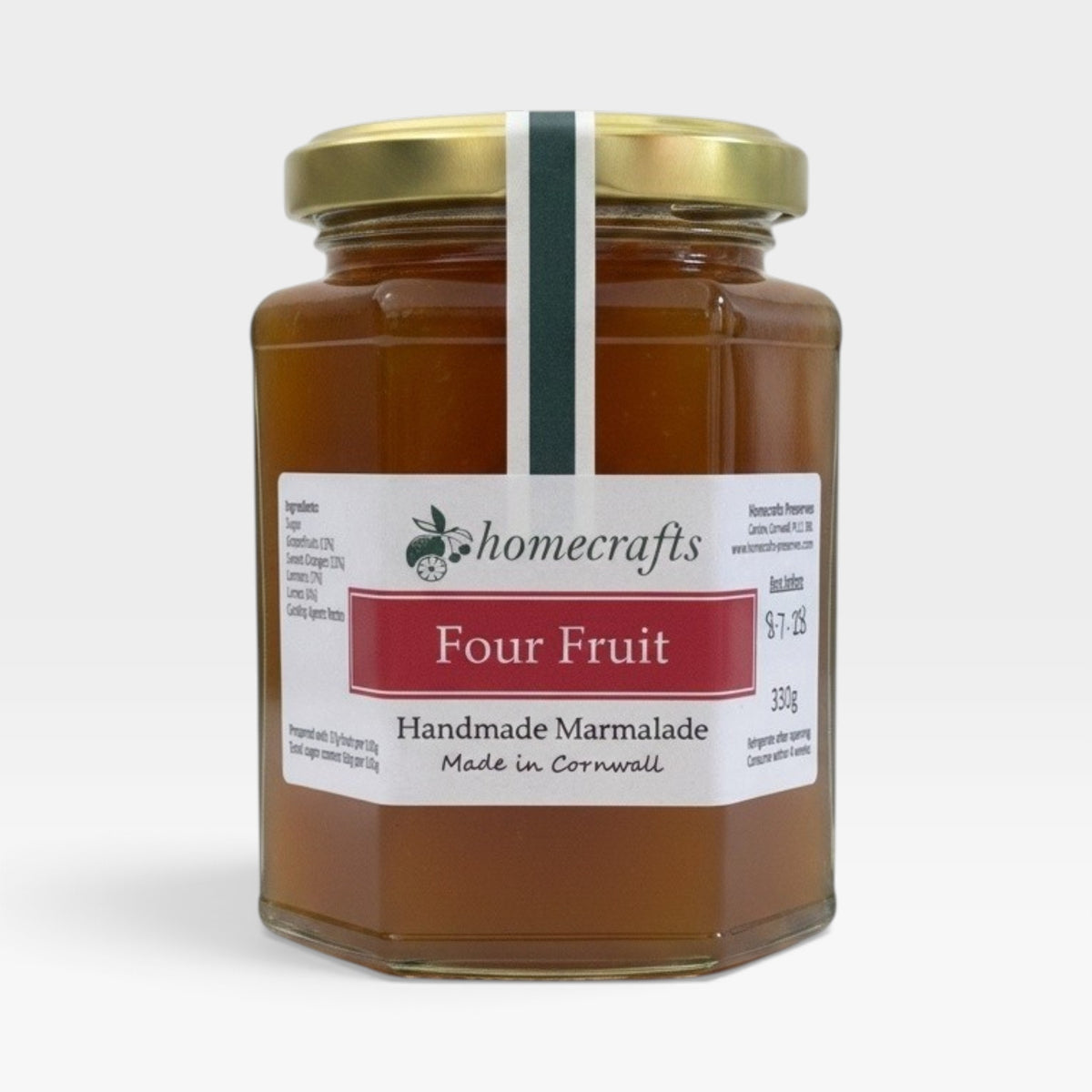 A glass jar of Homecrafts Four Fruit Handmade Marmalade with a gold lid and white label, set against a plain light gray background.